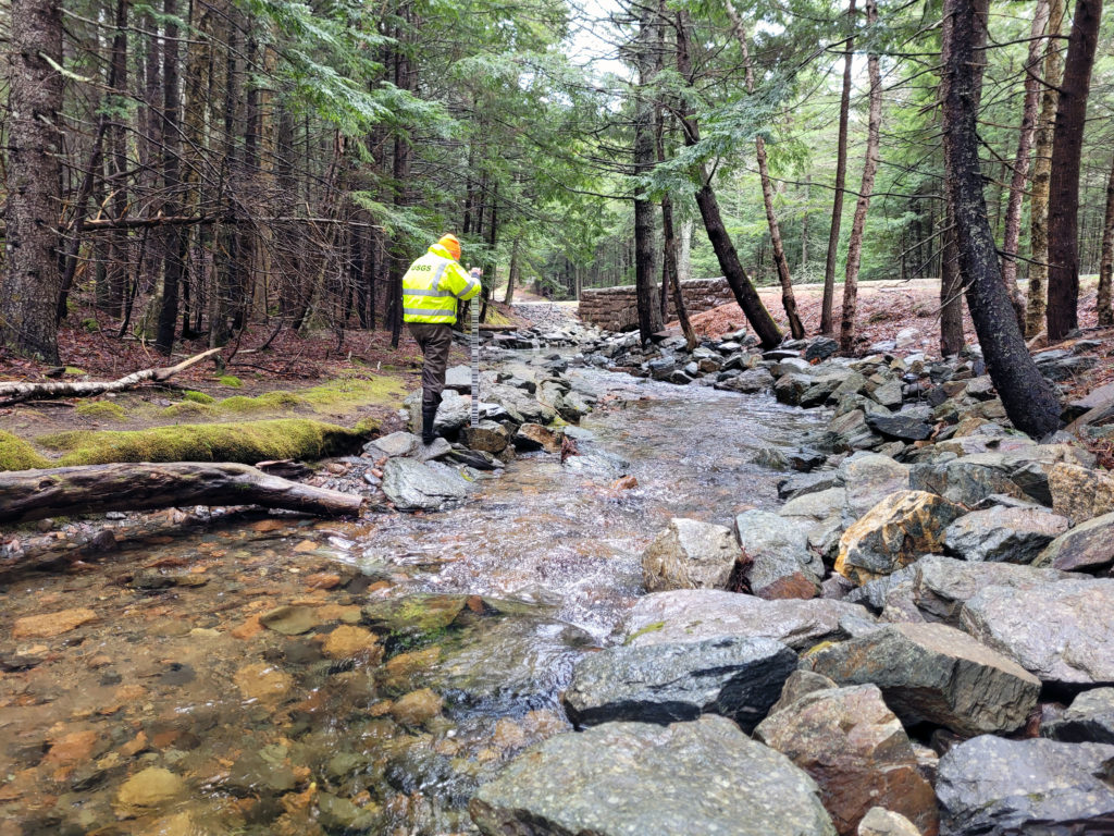 A USGS hydrologist conducting water sampling
